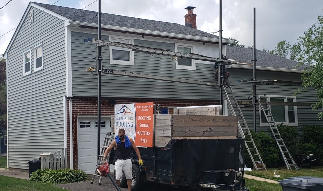 Roof Replacement in Manalapan, NJ GAF pewter gray siding replacement. CertainTeed Cypress Sididng.